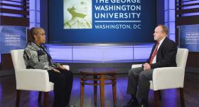 Associate Professor Sherry Molock sits on the left in conversation with Dean Paul Wahlbeck, on the right.